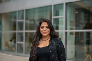 Portrait of Muskan outside The Commons windows